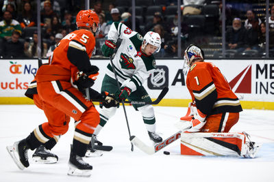 Nov 8, 2024; Anaheim, California, USA; Minnesota Wild center Marco Rossi (23) shoots the puck against Anaheim Ducks goaltender Lukas Dostal (1) during the third period of a hockey game at Honda Center. Mandatory Credit: Jessica Alcheh-Imagn Images