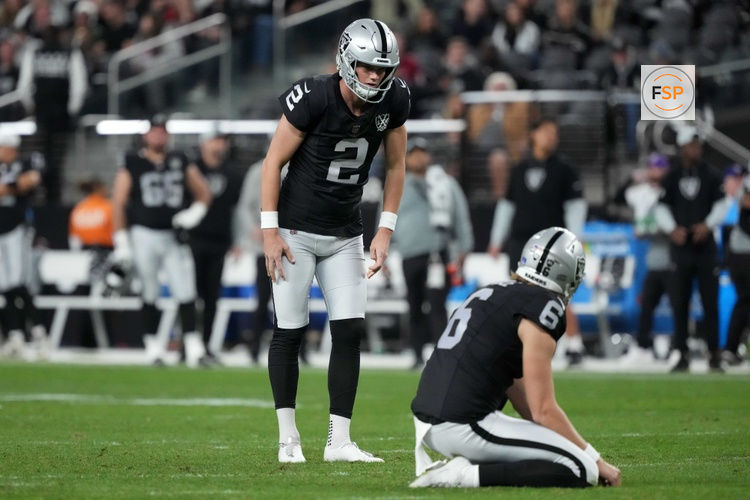 Dec 16, 2024; Paradise, Nevada, USA; Las Vegas Raiders place kicker Daniel Carlson (2) attempts a field goal out of the hold of punter AJ Cole (6) against the Atlanta Falcons in the second half at Allegiant Stadium. Credit: Kirby Lee-Imagn Images