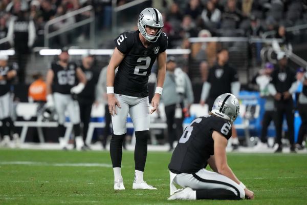 Dec 16, 2024; Paradise, Nevada, USA; Las Vegas Raiders place kicker Daniel Carlson (2) attempts a field goal out of the hold of punter AJ Cole (6) against the Atlanta Falcons in the second half at Allegiant Stadium. Mandatory Credit: Kirby Lee-Imagn Images