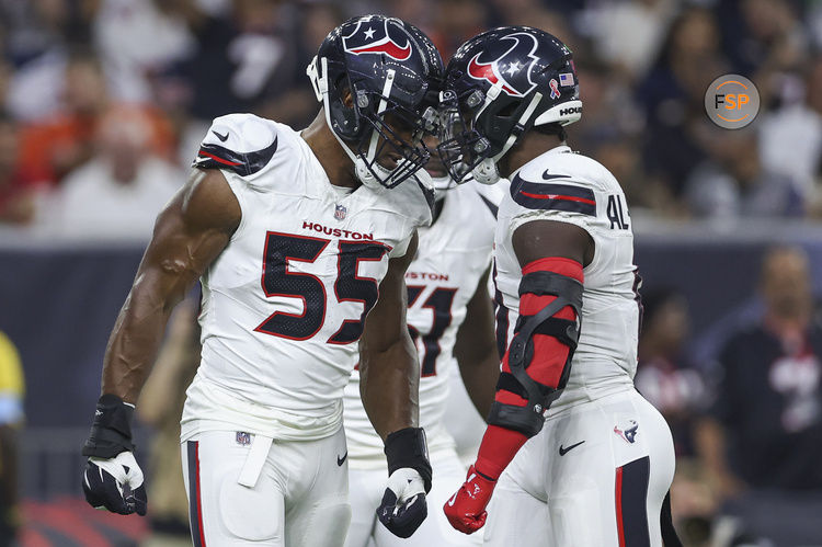 Sep 15, 2024; Houston, Texas, USA; Houston Texans defensive end Danielle Hunter (55) and linebacker Azeez Al-Shaair (0) react after a play during the first quarter against the Chicago Bears at NRG Stadium. Credit: Troy Taormina-Imagn Images