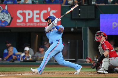 Aug 23, 2026; Arlington, Texas, USA;  Texas Rangers center fielder Ezequiel Duran (20) follows through on his solo home run against the Los Angeles Angels during the second inning at Globe Life Field.  Mandatory Credit: Jim Cowsert-Imagn Images