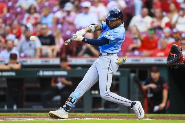 Jul 25, 2025; Cincinnati, Ohio, USA; Tampa Bay Rays outfielder Chandler Simpson (14) hits a double in the first inning against the Cincinnati Reds at Great American Ball Park. Mandatory Credit: Katie Stratman-Imagn Images