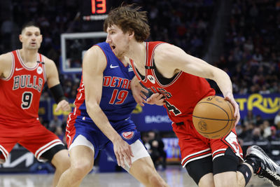 Feb 2, 2025; Detroit, Michigan, USA; Chicago Bulls forward Matas Buzelis (14) dribbles on Detroit Pistons forward Simone Fontecchio (19) in the first half at Little Caesars Arena. Mandatory Credit: Rick Osentoski-Imagn Images