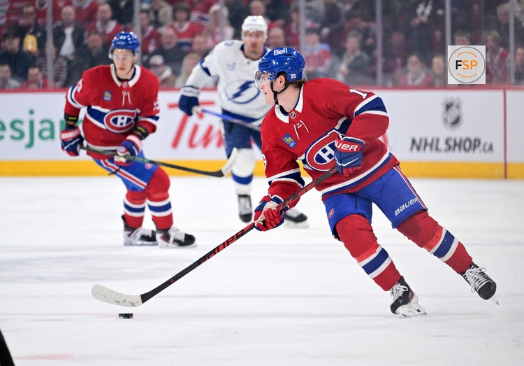 Apr 9, 2026; Montreal, Quebec, CAN; Montreal Canadiens forward Cole Caufield (13) plays the puck during the first period against the Tampa Bay Lightning at the Bell Centre. Credit: Eric Bolte-Imagn Images