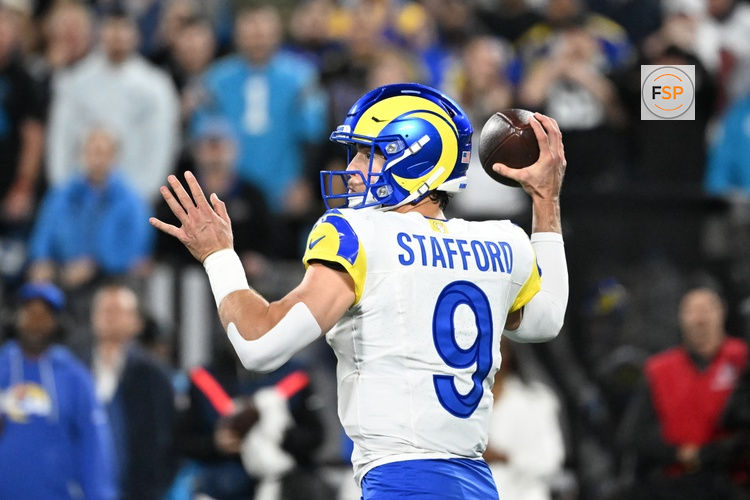 Jan 10, 2026; Charlotte, NC, USA; Los Angeles Rams quarterback Matthew Stafford (9) passes the ball in the fourth quarter in an NFC Wild Card Round game at Bank of America Stadium. Credit: Bob Donnan-Imagn Images