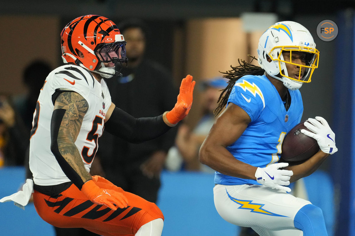 Nov 17, 2024; Inglewood, California, USA; Los Angeles Chargers wide receiver Quentin Johnston (1) is defended by Cincinnati Bengals linebacker Logan Wilson (55) on a 26-yard touchdown reception in the first half at SoFi Stadium. Credit: Kirby Lee-Imagn Images