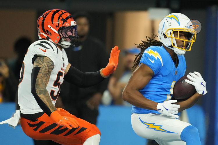 Nov 17, 2024; Inglewood, California, USA; Los Angeles Chargers wide receiver Quentin Johnston (1) is defended by Cincinnati Bengals linebacker Logan Wilson (55) on a 26-yard touchdown reception in the first half at SoFi Stadium. Credit: Kirby Lee-Imagn Images