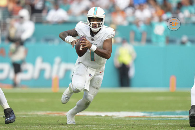 MIAMI GARDENS, FL - NOVEMBER 19: Miami Dolphins quarterback Tua Tagovailoa (1) scrambles with the ball during the game between the Las Vegas Raiders and the Miami Dolphins on Sunday, November 19, 2023 at Hard Rock Stadium, Miami, Fla. (Photo by Peter Joneleit/Icon Sportswire)