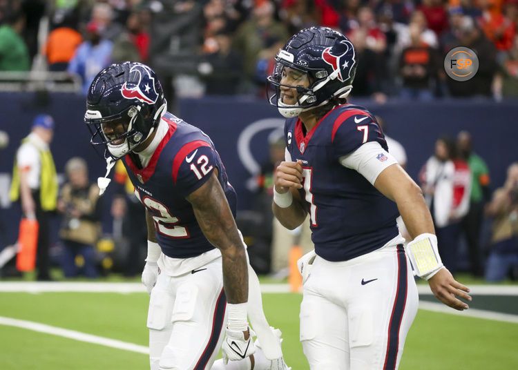 HOUSTON, TX - JANUARY 13:  Houston Texans quarterback C.J. Stroud (7) celebrates with Houston Texans wide receiver Nico Collins (12) on his touchdown in the first quarter during the AFC Wild Card game between the Cleveland Browns and Houston Texans on January 13, 2024 at NRG Stadium in Houston, Texas.  (Photo by Leslie Plaza Johnson/Icon Sportswire)