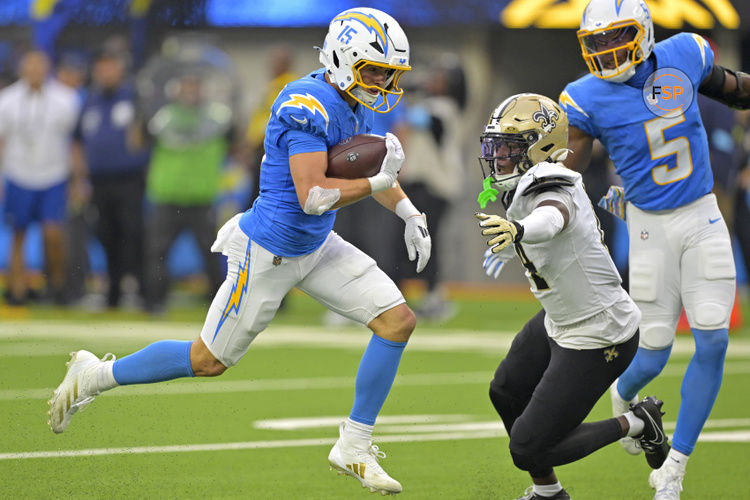 Oct 27, 2024; Inglewood, California, USA; Los Angeles Chargers wide receiver Ladd McConkey (15) catches a pass and runs past New Orleans Saints cornerback Kool-Aid McKinstry (14) for a touchdown in the second half at SoFi Stadium. Credit: Jayne Kamin-Oncea-Imagn Images