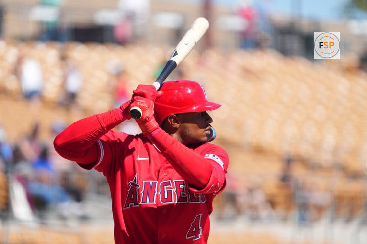 Mar 11, 2026; Phoenix, Arizona, USA; Los Angeles Angels second baseman Christian Moore (4) bats against the Chicago White Sox during the third inning at Camelback Ranch-Glendale. Credit: Joe Camporeale-Imagn Images