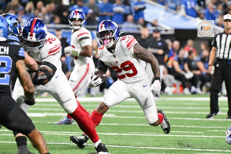 Nov 23, 2025; Detroit, Michigan, USA; New York Giants running back Tyrone Tracy Jr. (29) runs the ball in the fourth quarter against the Detroit Lions at Ford Field. Credit: Lon Horwedel-Imagn Images