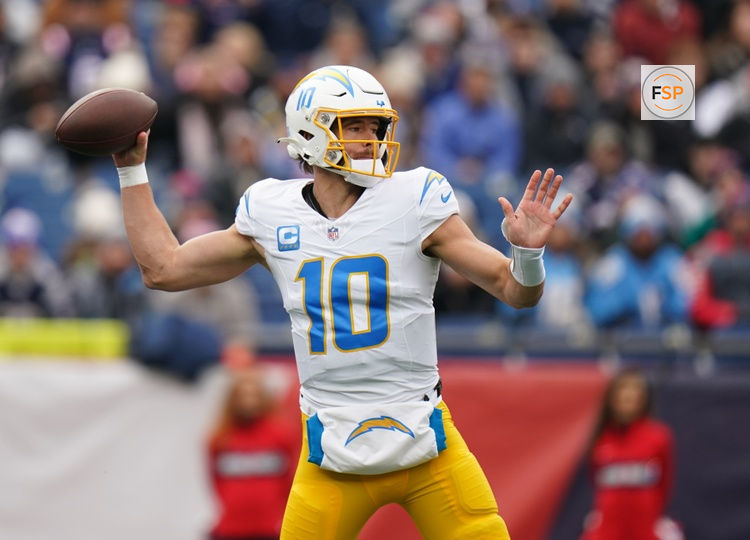 Dec 28, 2024; Foxborough, Massachusetts, USA; Los Angeles Chargers quarterback Justin Herbert (10) passes the ball against the New England Patriots in the first quarter at Gillette Stadium. Credit: David Butler II-Imagn Images