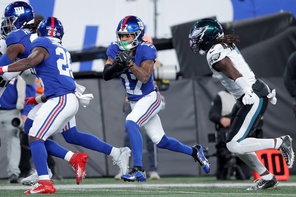 Oct 9, 2025; East Rutherford, New Jersey, USA; New York Giants wide receiver Wan'Dale Robinson (17) runs with the ball for a touchdown against Philadelphia Eagles cornerback Kelee Ringo (7) during the first quarter at MetLife Stadium. Mandatory Credit: Brad Penner-Imagn Images