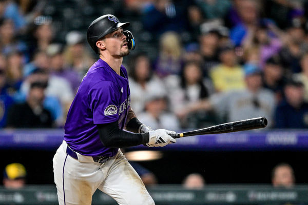 DENVER, CO - JULY: 01: Colorado Rockies center fielder Brenton Doyle (9) hits an eighth inning solo home run during a game between the Milwaukee Brewers and the Colorado Rockies at Coors Field on July 1, 2024 in Denver, Colorado. (Photo by Dustin Bradford/Icon Sportswire)