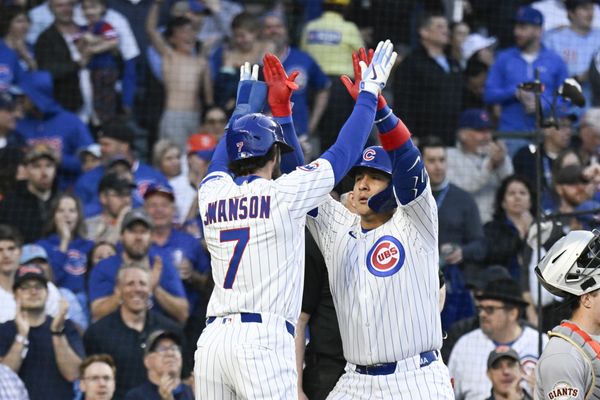 May 6, 2025; Chicago, Illinois, USA;  Chicago Cubs catcher Miguel Amaya (9) high fives Chicago Cubs shortstop Dansby Swanson (7) after they score on his two run home run during the third inning against the San Francisco Giants at Wrigley Field. Mandatory Credit: Matt Marton-Imagn Images