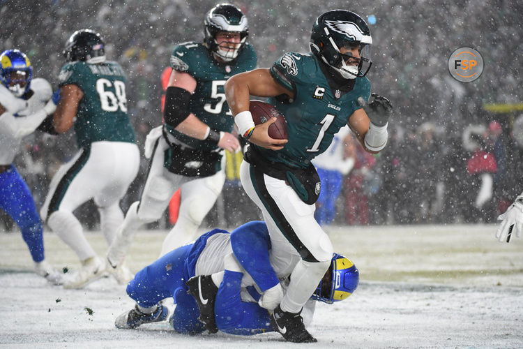 Jan 19, 2025; Philadelphia, Pennsylvania, USA; Philadelphia Eagles quarterback Jalen Hurts (1) is sacked in the end zone for a safety during the third quarter by Los Angeles Rams defensive tackle Neville Gallimore (92) in a 2025 NFC divisional round game at Lincoln Financial Field. Credit: Eric Hartline-Imagn Images