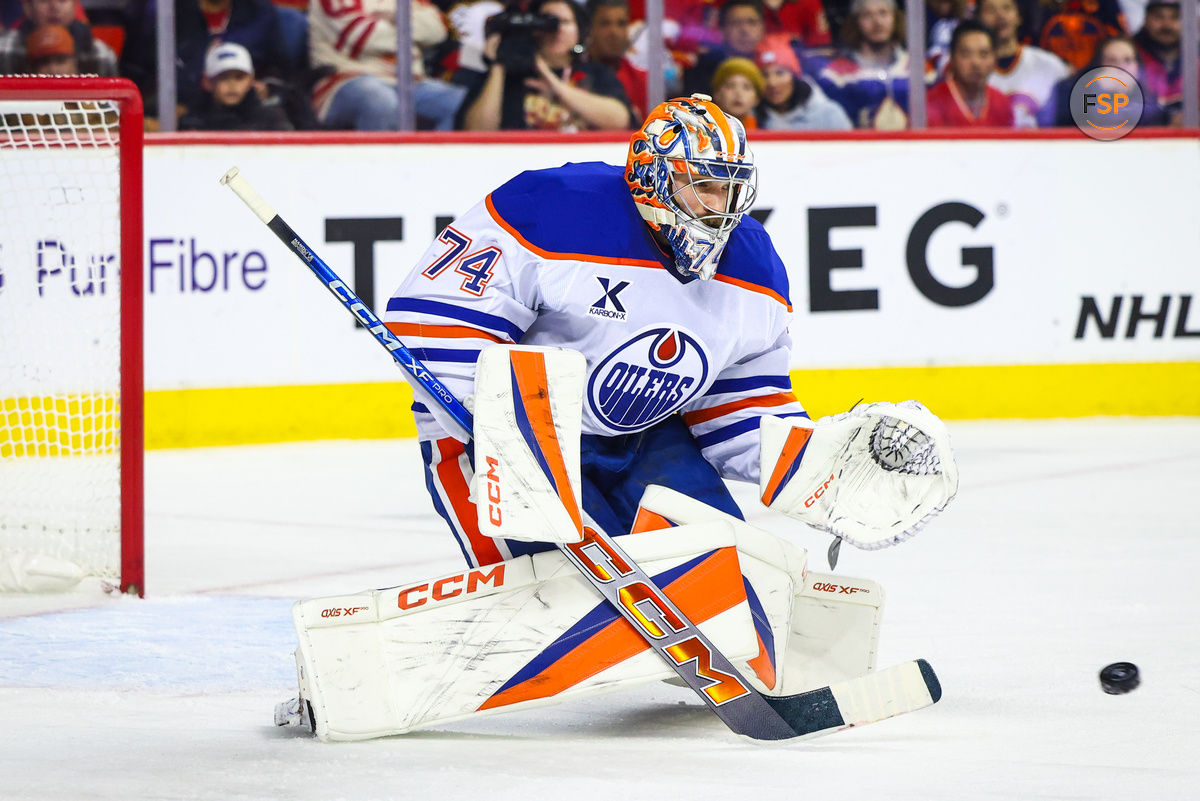 Nov 3, 2024; Calgary, Alberta, CAN; Edmonton Oilers goaltender Stuart Skinner (74) makes a save against the Calgary Flames during the second period at Scotiabank Saddledome. Credit: Sergei Belski-Imagn Images