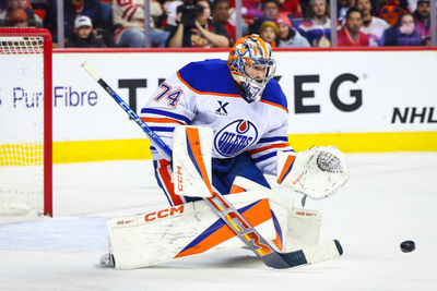 Nov 3, 2024; Calgary, Alberta, CAN; Edmonton Oilers goaltender Stuart Skinner (74) makes a save against the Calgary Flames during the second period at Scotiabank Saddledome. Mandatory Credit: Sergei Belski-Imagn Images