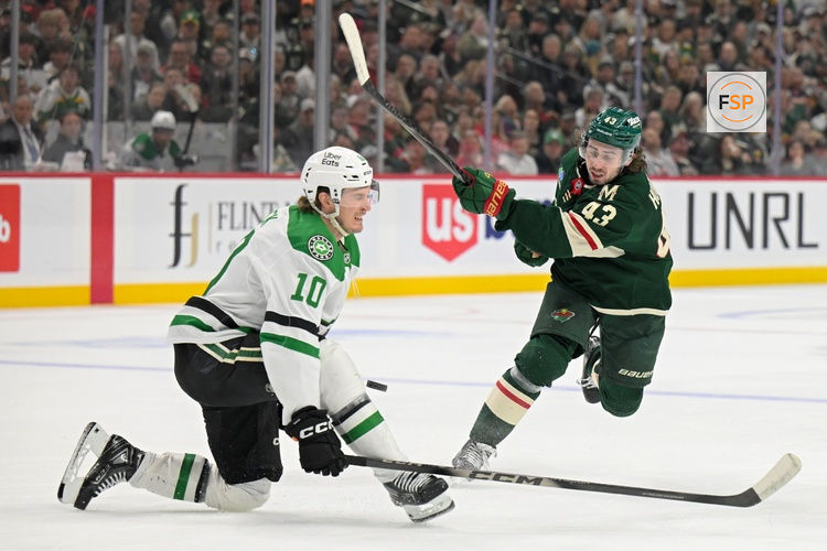 Apr 30, 2026; Saint Paul, Minnesota, USA; Dallas Stars forward Oskar Back (10) blocks the shot attempt of Minnesota Wild defensemen Quinn Hughes (43) during the second period in game six of the first round of the 2026 Stanley Cup Playoffs at Grand Casino Arena. Credit: Nick Wosika-Imagn Images