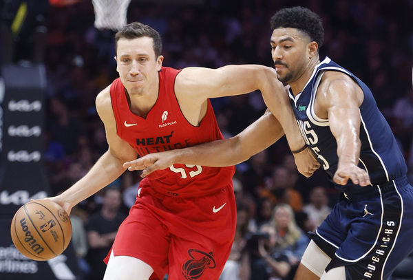 Nov 24, 2024; Miami, Florida, USA;  Dallas Mavericks guard Quentin Grimes (5) defends Miami Heat forward Duncan Robinson (55) during the first half  at Kaseya Center. Mandatory Credit: Rhona Wise-Imagn Images